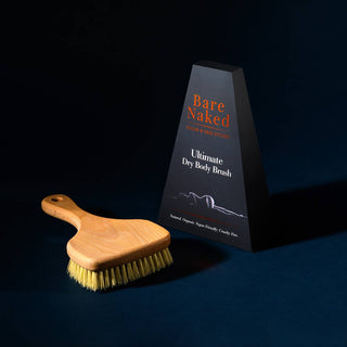 Wooden dry body brush with 'Bare Naked' packaging on a dark background - Pangolins