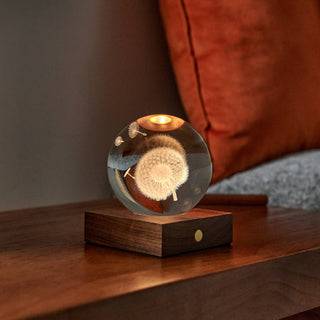Decorative lamp with dandelion design on a wooden base, placed on a surface with a blurred background - Pangolins