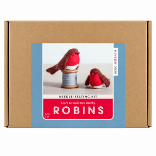 A cardboard box for a needle-felting kit, featuring a front label with photos of two small robins and the text 'NEEDLE-FELTING KIT', 'LEARN TO MAKE TWO CHUBBYS', 'AGE 12+', and 'BERGEN BATH'.