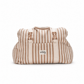 By Teddy Canvas Dog Car Seat in Hazelnut Stripe, shown folded as a stylish travel bag with carry straps. 