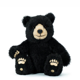 Black teddy bear with a white face on a white background - Pangolins