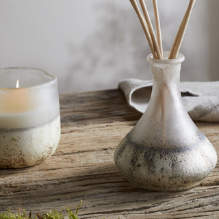Nkuku eco-friendly reed diffuser with sea salt and moss scent in recycled glass vessel close-up