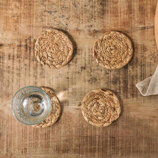 Nkuku Lam water hyacinth coasters set of four natural woven eco-friendly table setting