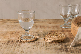 Nkuku Lam water hyacinth coasters set of four natural woven eco-friendly table setting