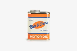 Motor oil can of coffee beans with 'Ride & Grind' label on a white background