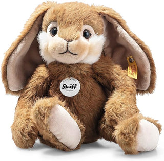 Brown plush bunny with white paws and a Steiff tag on a white background - Pangolins