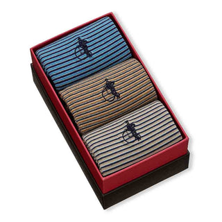 Three pairs of striped socks in a black box with a logo on a white background
