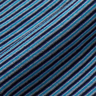A close-up of a woven fabric with diagonal stripes in navy blue, bright blue, teal, and light gray.