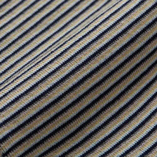 Close-up of a striped woven fabric with alternating dark navy and beige diagonal stripes.