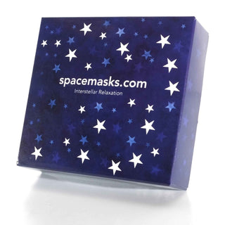 A square product box for spacemasks.com 'Interstellar Relaxation' featuring a deep blue space-themed design with scattered white and light blue stars, shown on a white background.