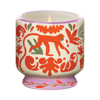 A Dopo jungle ceramic candle, painted ceramic pot with orange monkeys and jungle leaves - Pangolins
