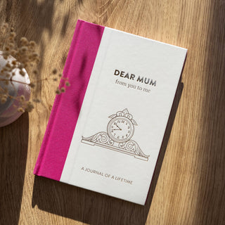 Journal titled 'Dear Mum from you to me' on a wooden surface with a pink spine - Pangolins