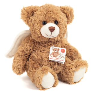 Brown teddy bear with a white label on a white background