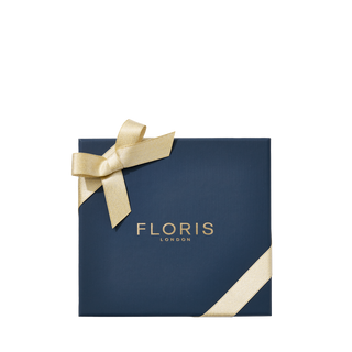 Navy gift box with gold ribbon and 'FLORIS LONDON' branding on a white background