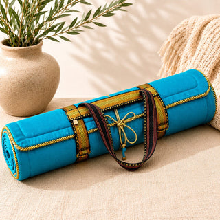 Holistic Silk Aegean Blue yoga rug mat styled in a calm wellness-inspired interior with natural textures, ceramic vase and soft furnishings
