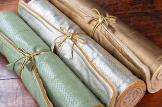 Yoga Mat for Ultimate Comfort and Style, green, silver and gold mats rolled and tied with matching ties - Pangolins