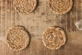 Nkuku Lam water hyacinth coasters set of four natural woven eco-friendly table setting